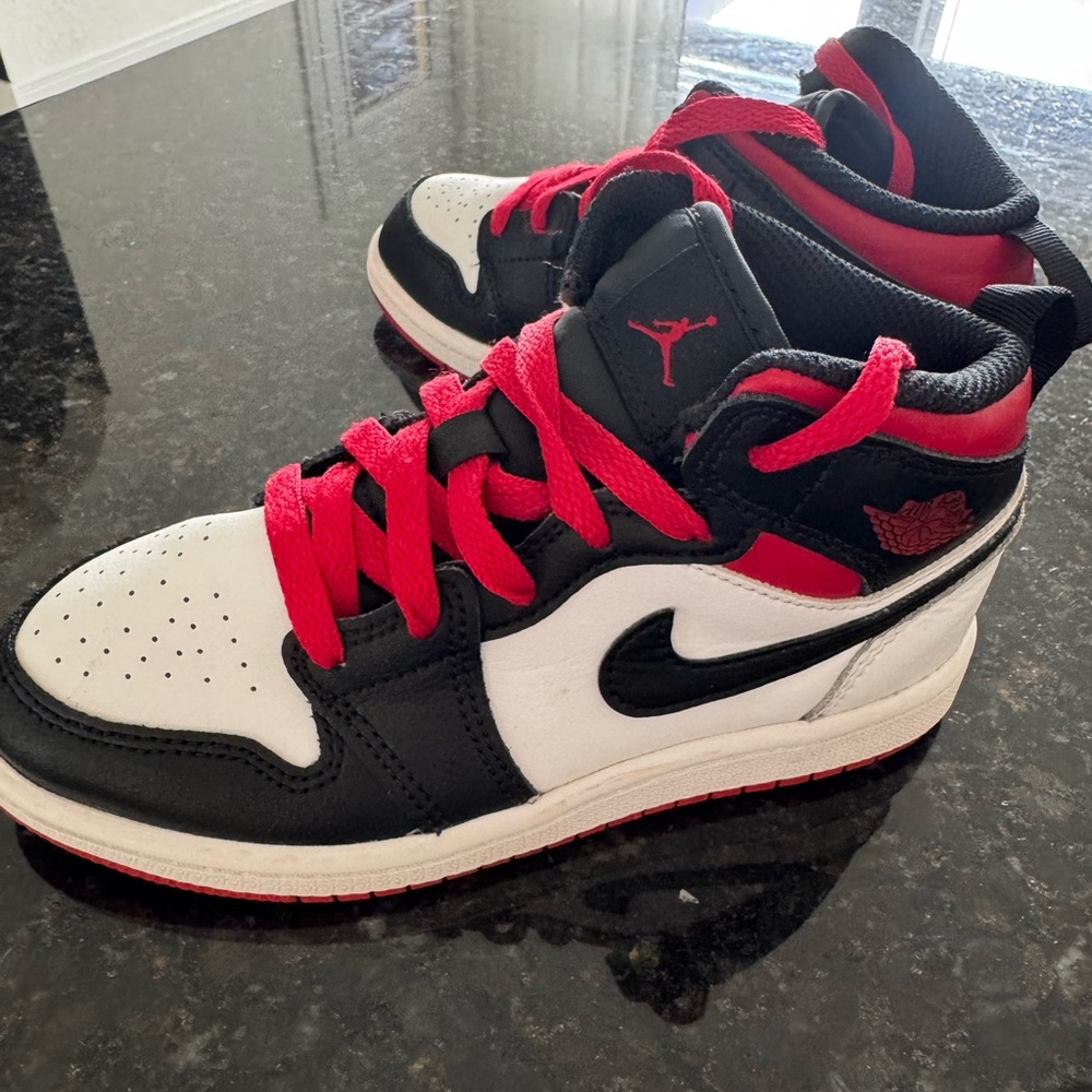 Kids Jordan’s Black and Red Sneakers